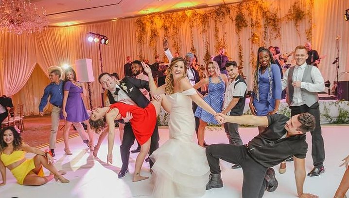 Wedding guests dancing the hora at a reception