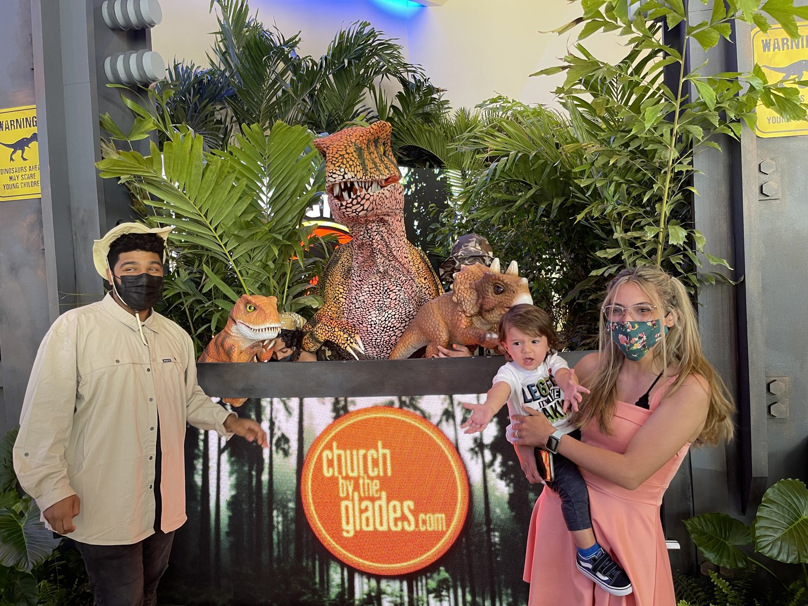 Custom jungle photo-op build with sculpted dinosaur and foliage