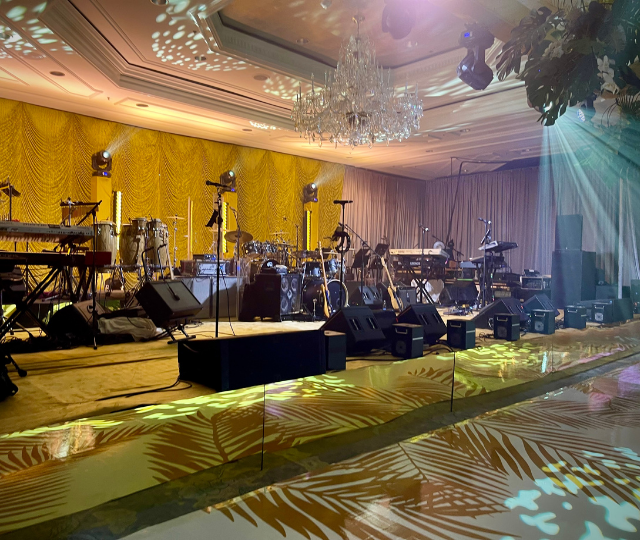 Fully produced stage set for a live band inside an elegant ballroom, ready for a national headliner