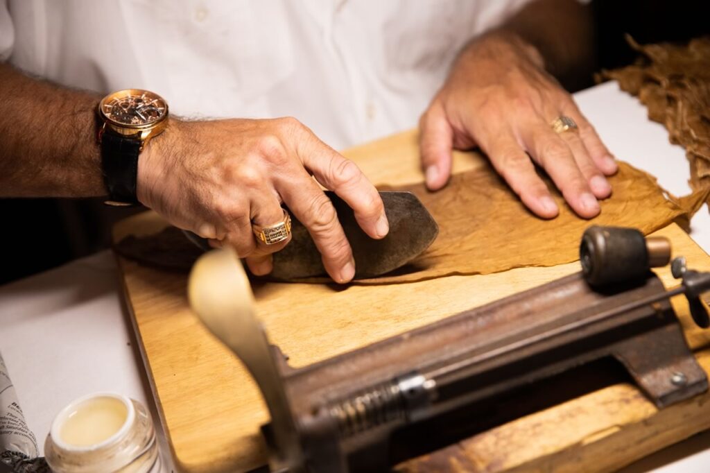 Live cigar roller station at a corporate event