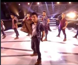 Quest Crew performing their choreographed set on stage at a private event