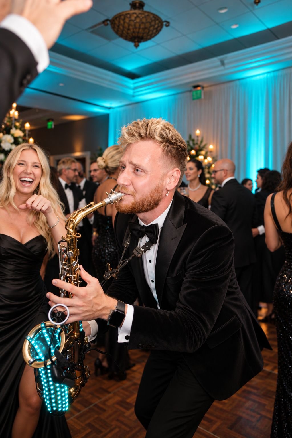 Saxophonist performing among guests on the dance floor