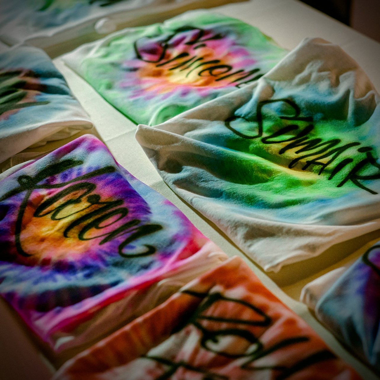Airbrushed custom hats and apparel made live for guests
